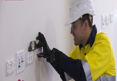 Electrician Working on Electrical Outlets